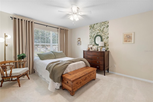 bedroom with light colored carpet and ceiling fan