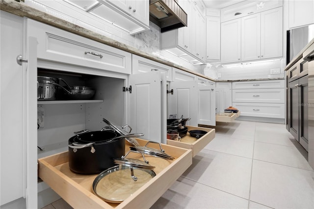 interior space featuring tasteful backsplash and tile patterned floors