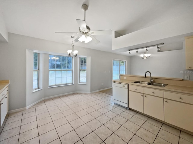 kitchen with white dishwasher, sink, decorative light fixtures, light tile patterned floors, and ceiling fan with notable chandelier