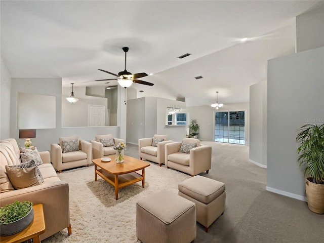 living room with ceiling fan with notable chandelier, light carpet, and lofted ceiling