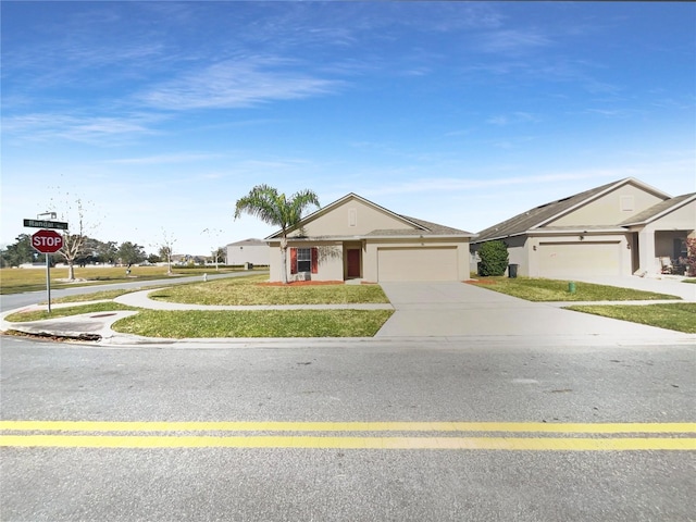 ranch-style house with a garage and a front lawn