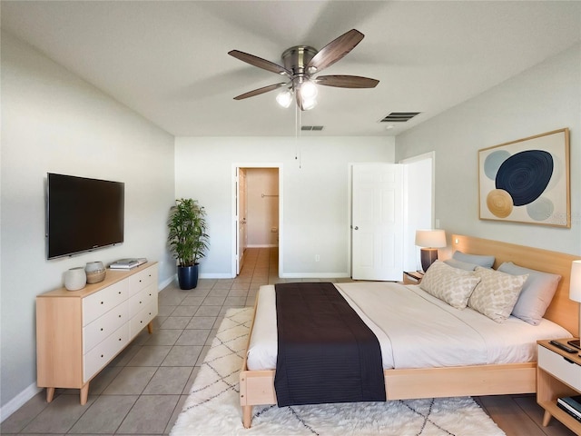 bedroom with ceiling fan and light tile patterned flooring