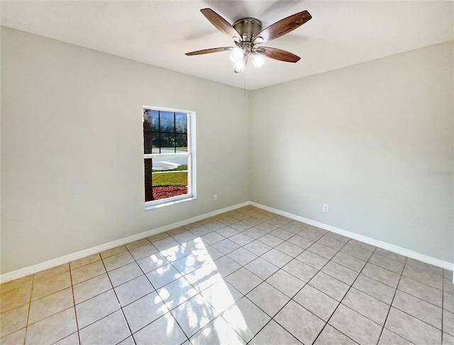 empty room featuring light tile patterned floors and ceiling fan