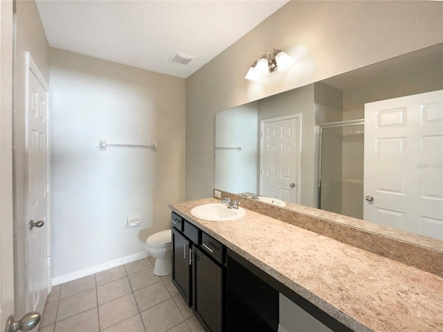 bathroom featuring tile patterned floors, walk in shower, toilet, and vanity