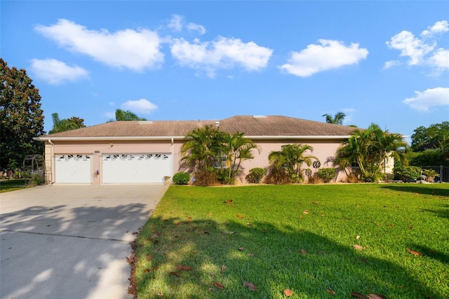 view of front of home featuring a garage and a front yard