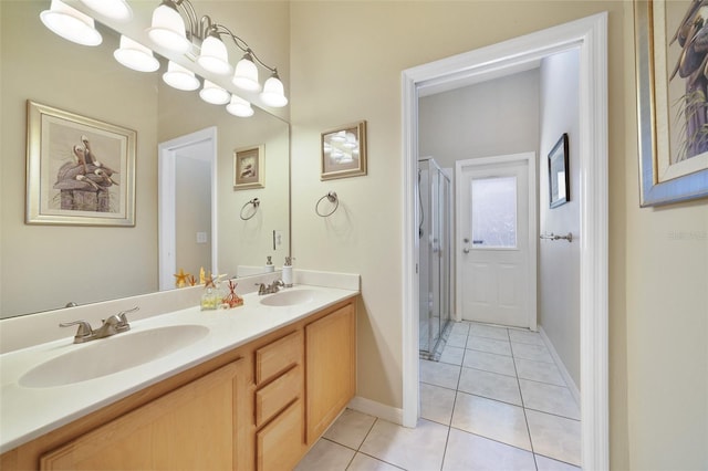 bathroom with tile patterned floors and vanity