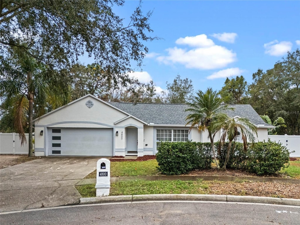 ranch-style home featuring a garage