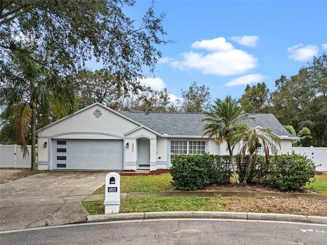 ranch-style home featuring a garage