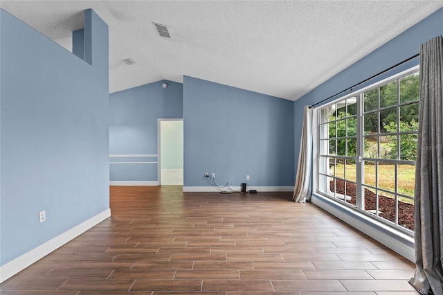 unfurnished living room featuring lofted ceiling