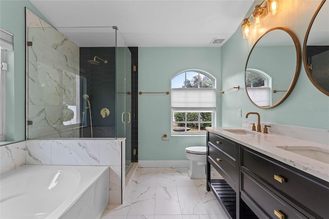 full bathroom featuring vanity, separate shower and tub, and toilet