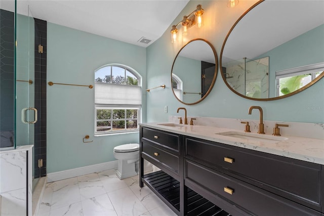 bathroom featuring vanity, vaulted ceiling, toilet, and a shower with shower door