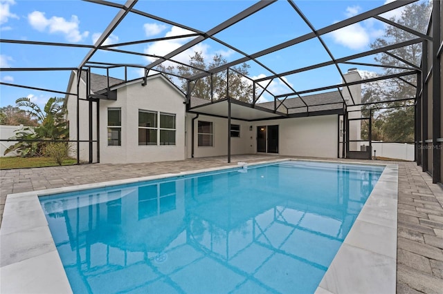 view of pool with a lanai and a patio area