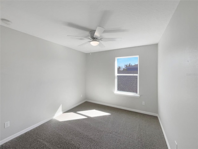 spare room featuring ceiling fan and carpet flooring