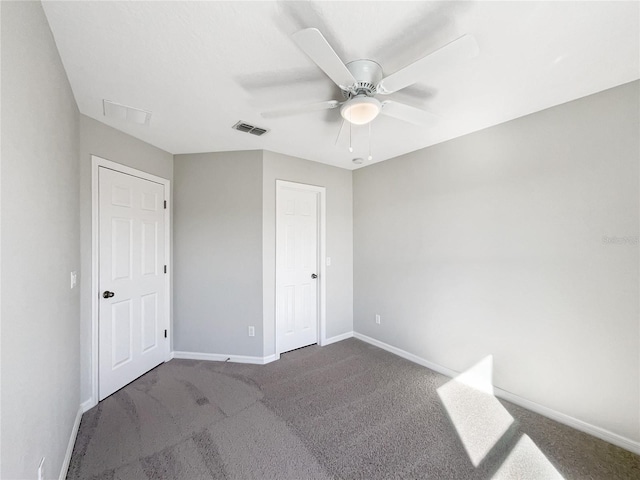 unfurnished bedroom with ceiling fan and carpet