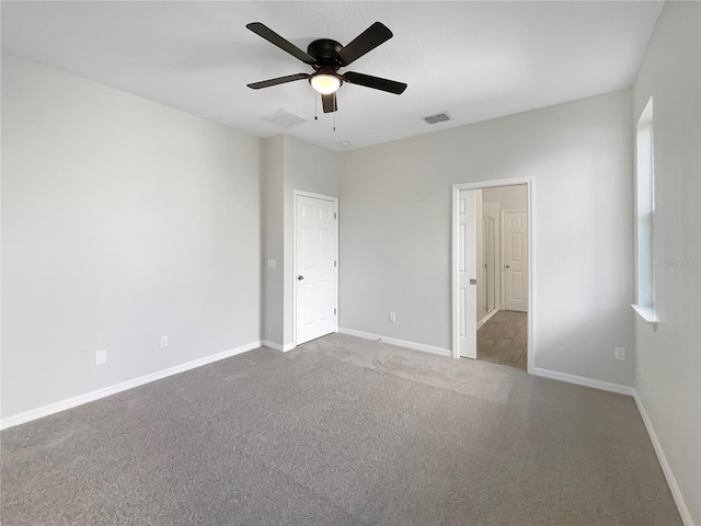 unfurnished bedroom with ceiling fan and carpet