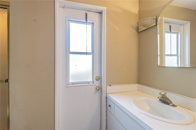 bathroom featuring vanity and a healthy amount of sunlight