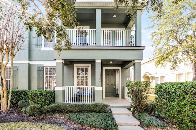 entrance to property with a balcony