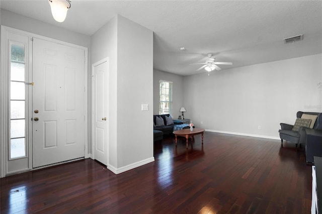 entrance foyer featuring ceiling fan and dark hardwood / wood-style flooring