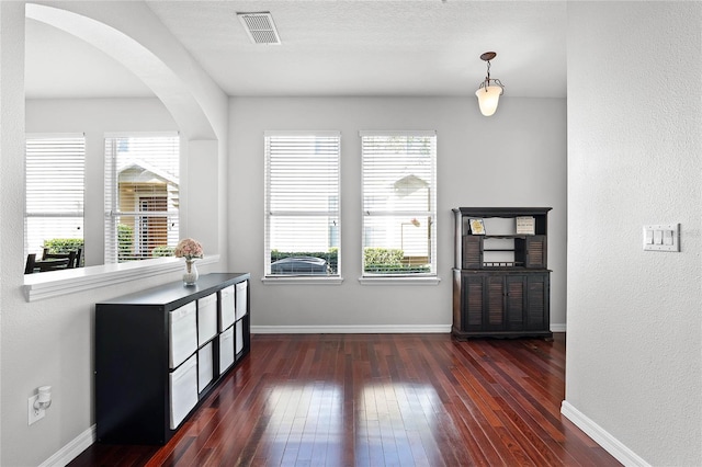 entryway featuring dark hardwood / wood-style floors and a textured ceiling