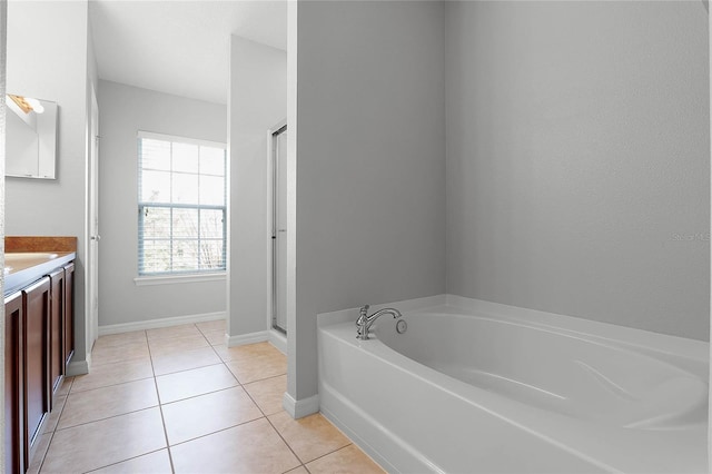 bathroom with vanity, independent shower and bath, and tile patterned flooring