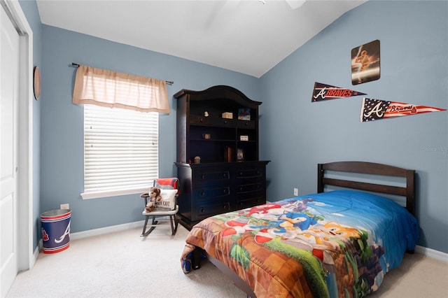 bedroom featuring ceiling fan, lofted ceiling, and carpet flooring