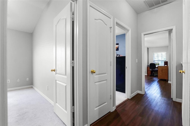 hallway featuring dark hardwood / wood-style floors