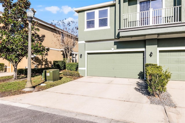 view of front of house featuring a balcony and a garage