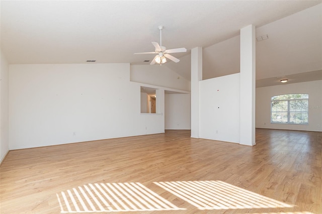 unfurnished room featuring a ceiling fan, visible vents, light wood finished floors, and high vaulted ceiling