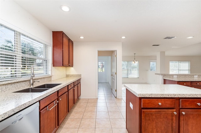 kitchen featuring visible vents, dishwasher, light tile patterned floors, recessed lighting, and a sink