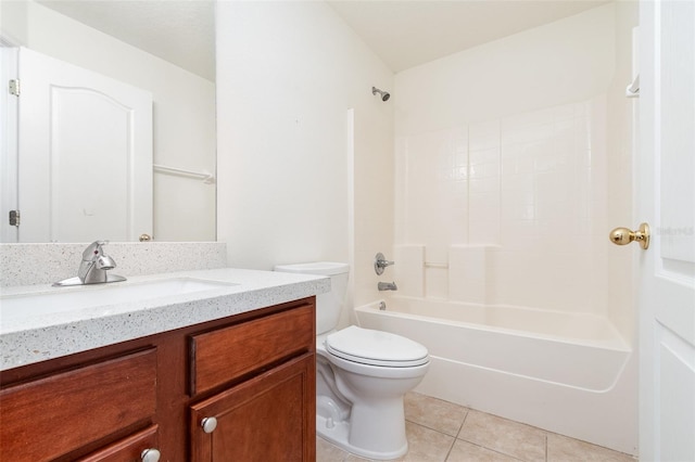 bathroom with tile patterned floors, toilet, vanity, and  shower combination