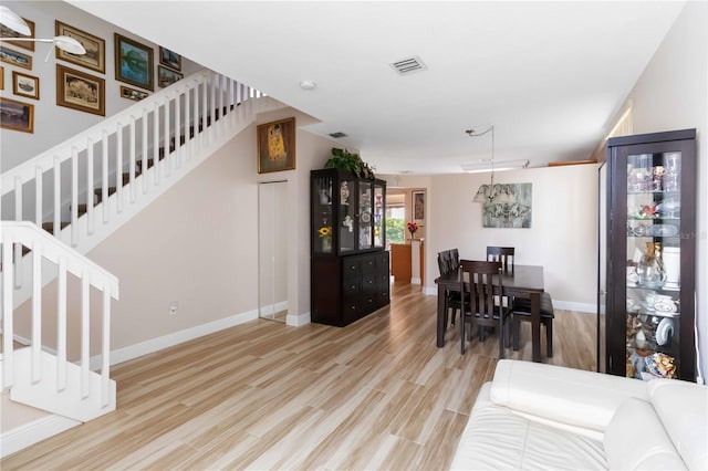 dining area with light wood-type flooring