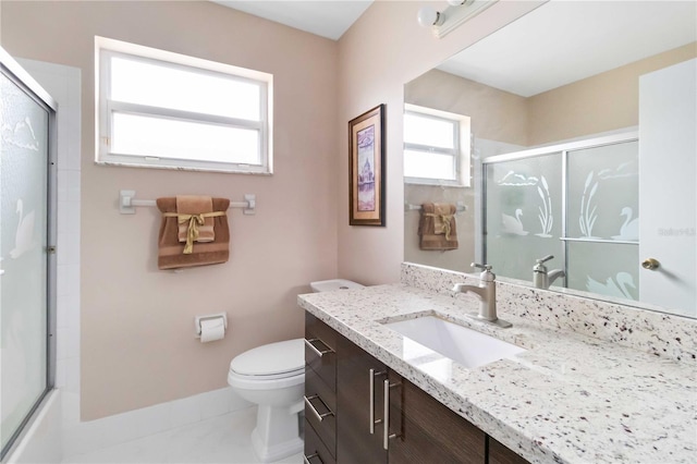 full bathroom featuring vanity, toilet, enclosed tub / shower combo, and tile patterned floors