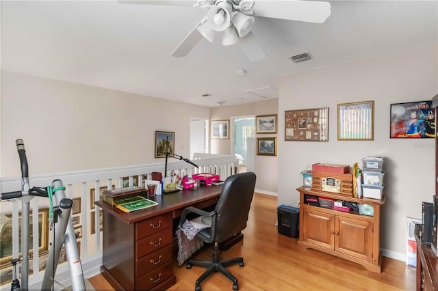 office featuring light hardwood / wood-style floors and ceiling fan