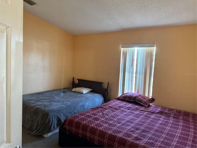 bedroom featuring a textured ceiling