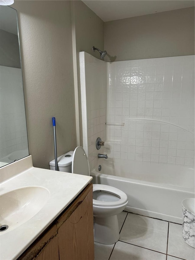 full bathroom with tile patterned flooring, vanity, toilet, and washtub / shower combination