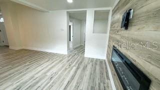 unfurnished living room with light wood-style floors