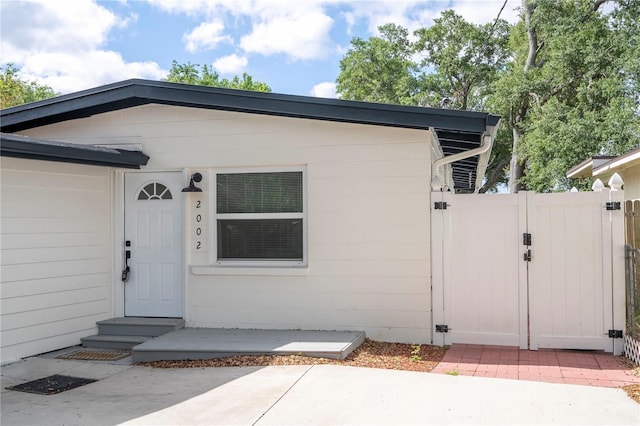 2002 Geigel Ave, Orlando, FL 32806 - view of exterior entry with a gate and fence