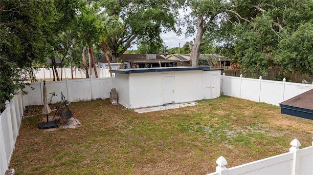 2002 Geigel Ave, Orlando, FL 32806 - view of yard with a fenced backyard, a shed, and an outbuilding