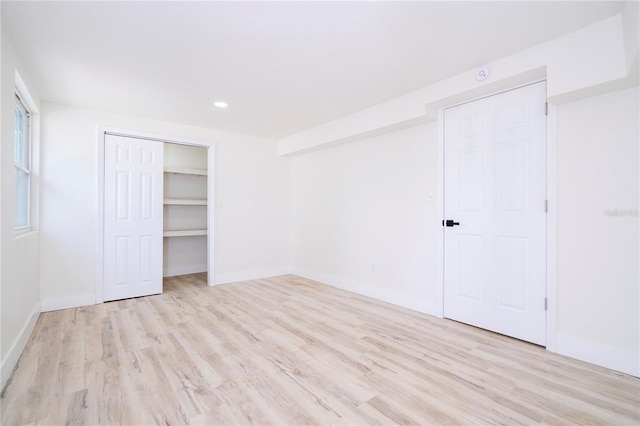 2002 Geigel Ave, Orlando, FL 32806 - unfurnished bedroom with recessed lighting, baseboards, a closet, and wood finished floors