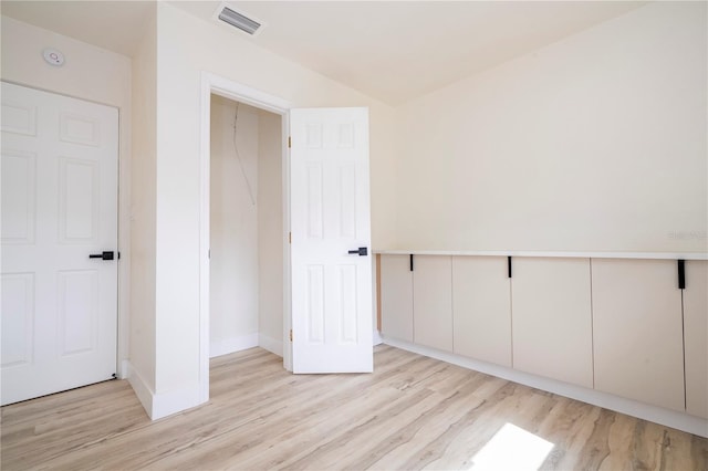 2002 Geigel Ave, Orlando, FL 32806 - spare room with light wood finished floors, baseboards, and visible vents