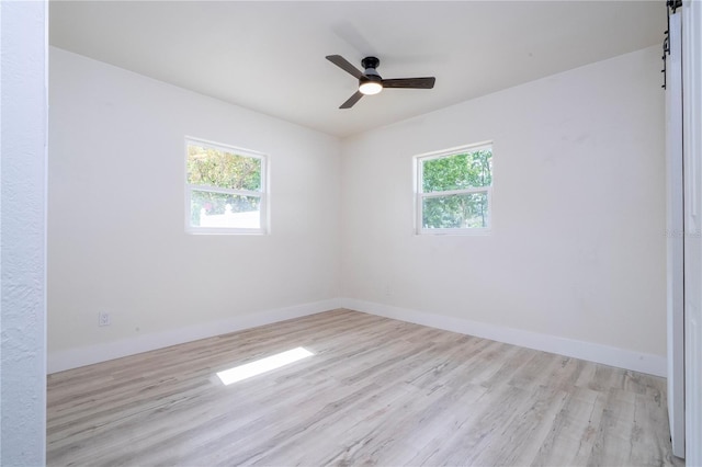 2002 Geigel Ave, Orlando, FL 32806 - unfurnished room with baseboards, wood finished floors, and a ceiling fan