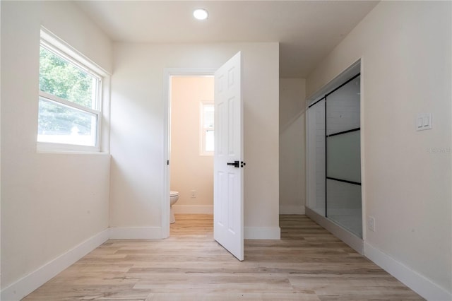2002 Geigel Ave, Orlando, FL 32806 - unfurnished bedroom featuring baseboards, light wood-type flooring, a closet, and recessed lighting