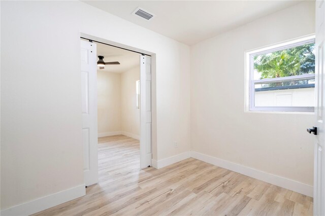 2002 Geigel Ave, Orlando, FL 32806 - empty room featuring light wood-type flooring, baseboards, and visible vents