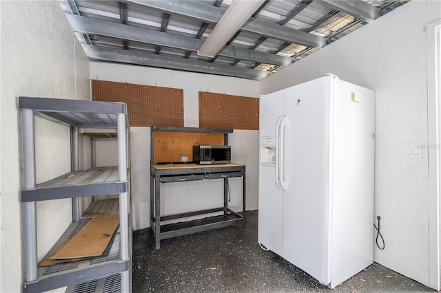 2002 Geigel Ave, Orlando, FL 32806 - interior space featuring stainless steel microwave and white fridge with ice dispenser