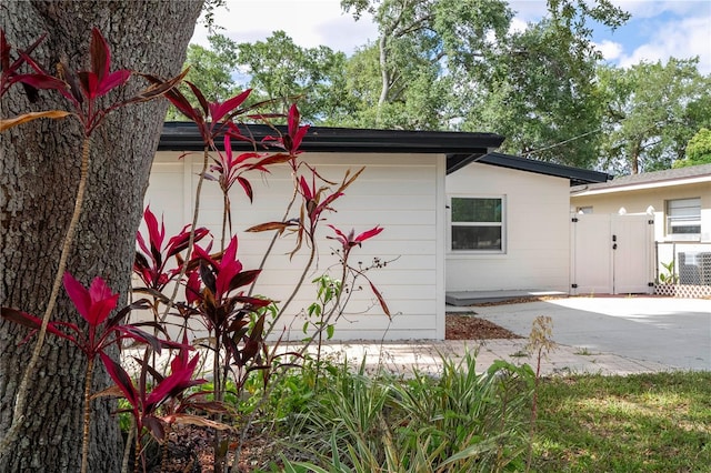 2002 Geigel Ave, Orlando, FL 32806 - view of property exterior with fence and an attached garage