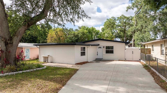 2002 Geigel Ave, Orlando, FL 32806 - view of front of house featuring fence, driveway, and a gate