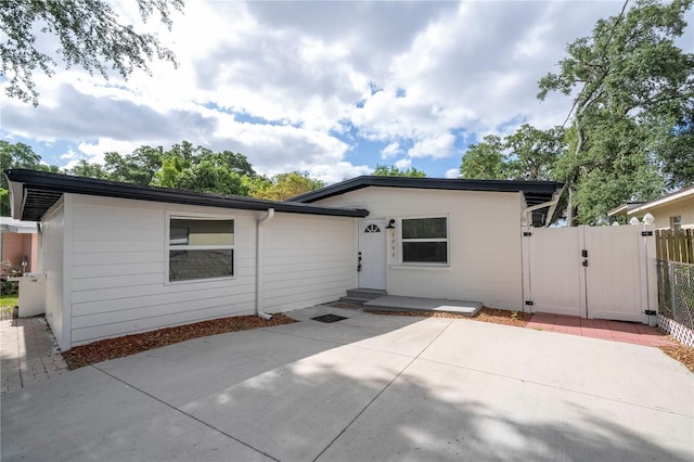 2002 Geigel Ave, Orlando, FL 32806 - ranch-style house with a patio area, a gate, and fence