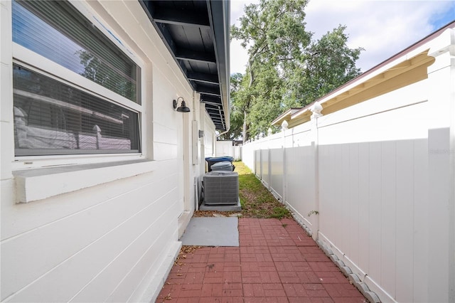 2002 Geigel Ave, Orlando, FL 32806 - view of property exterior featuring central air condition unit, fence, and a patio