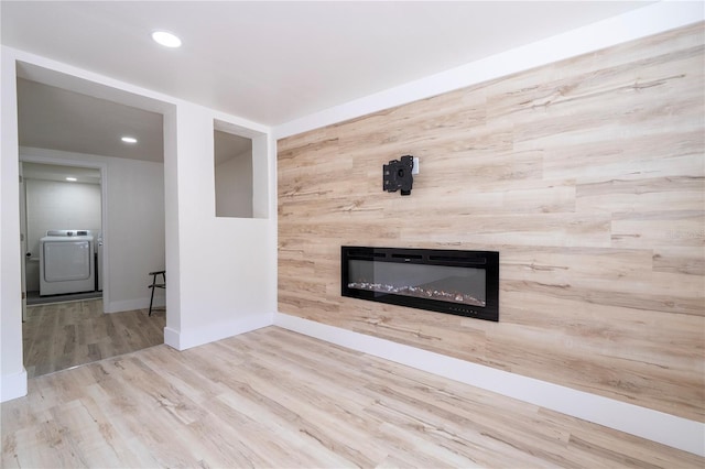 2002 Geigel Ave, Orlando, FL 32806 - unfurnished living room with a glass covered fireplace, wood finished floors, recessed lighting, and baseboards