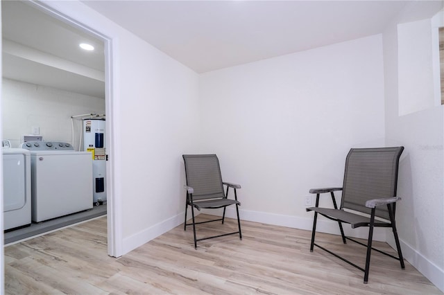 2002 Geigel Ave, Orlando, FL 32806 - living area featuring separate washer and dryer, water heater, wood finished floors, baseboards, and recessed lighting